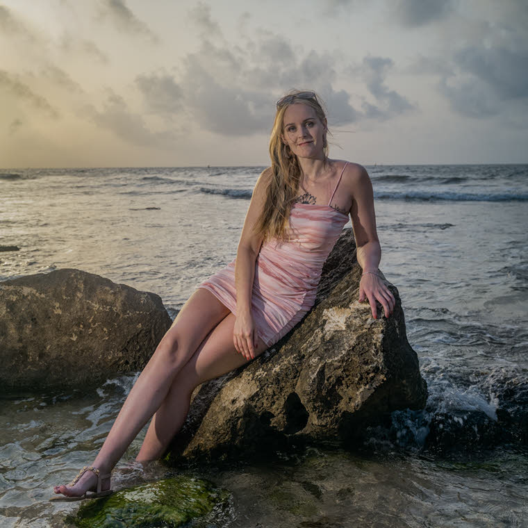 Latino Womans Serene Beach Pose in Mexico | MUSE AI