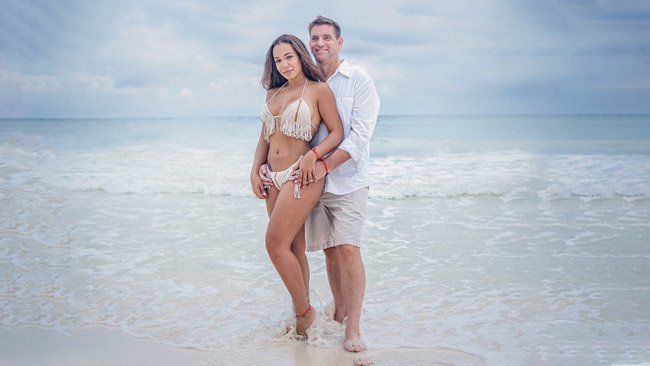 tulum couple walking down beach photographer