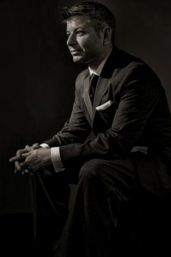 black and white man in a suit - male pose