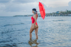red one piece swimsuit at the beach