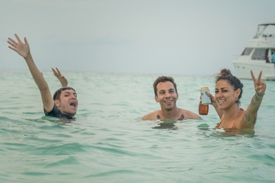 Isla Mujeres Boat &Amp; Catamaran Day Trips From Cancun 2 group having  a party at  isla mujeres