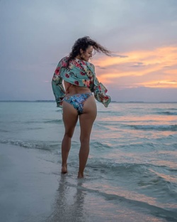 women bikini poses  at sunset cancun mexico