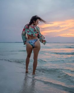 women bikini poses  at sunset cancun mexico