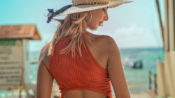 girl at the beach in a hat - fashion pose