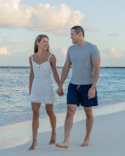 couple walking on the beach in tulum